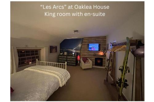 a bedroom with a bed and a king room with an attic at Oaklea House in Stoke on Trent