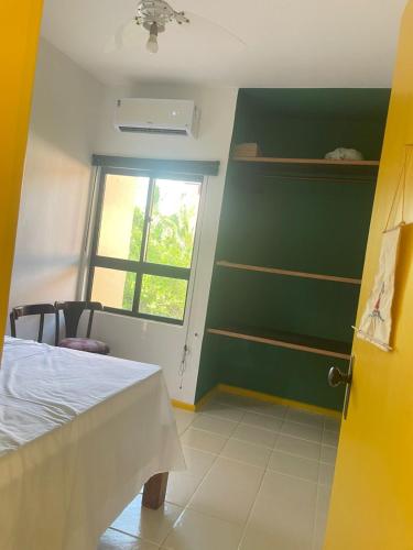 Ένα ή περισσότερα κρεβάτια σε δωμάτιο στο Aconchegante e tranquil