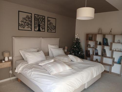 En eller flere senge i et værelse på Chambre chez l'habitant