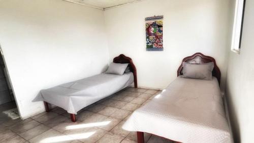 Postel nebo postele na pokoji v ubytování Pousada Sete Montanhas