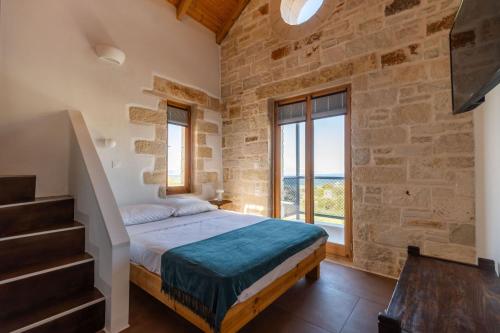 En eller flere senge i et værelse på Villa Lavidona by PosarelliVillas