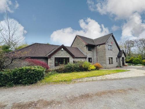 a large brick house with a roof at Carreg Llwyd in Caerphilly