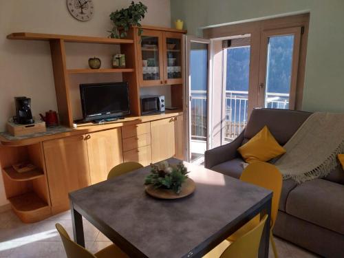 a living room with a couch and a table at Bella Vista casa vacanze in Grosio