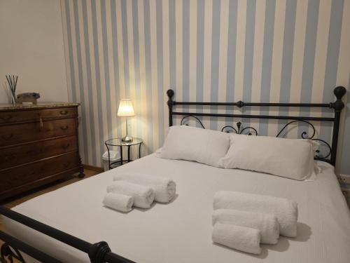 a bedroom with a bed with two towels on it at MR House - by Be Your Home in Rome