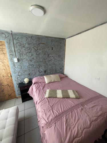 Postel nebo postele na pokoji v ubytování Cabaña Floppy Yumbel