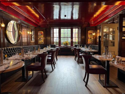 a dining room with long tables and chairs at Durrants Hotel in London