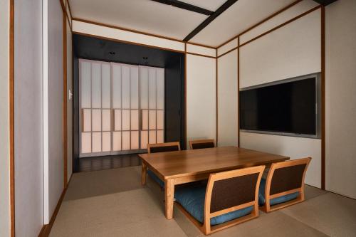 TV a/nebo společenská místnost v ubytování Kikuyu No Yado