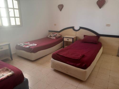 En eller flere senge i et værelse på Résidence Laguna