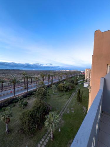 a view from the balcony of a building with palm trees at artisanat in Mohammedia