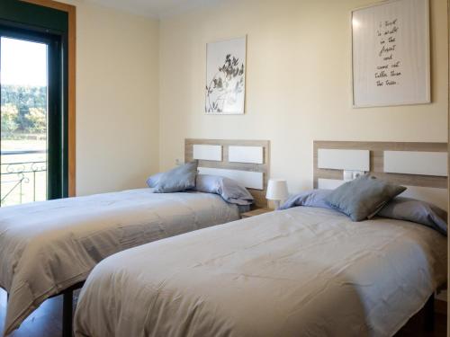 Ένα ή περισσότερα κρεβάτια σε δωμάτιο στο livinggaliciabeach - Terra