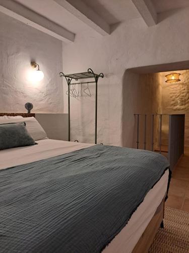 a bedroom with a large bed in a room at Casa Luna Miel in Frigiliana