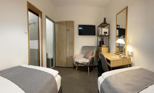 Postel nebo postele na pokoji v ubytování Penzion U Kašpara