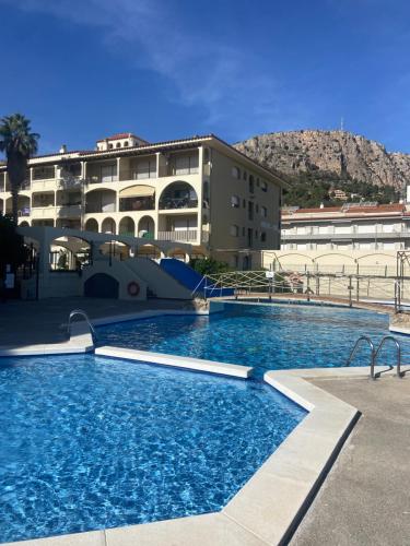 a large swimming pool in front of a building at Estartit Jardins del mar 51 in L'Estartit