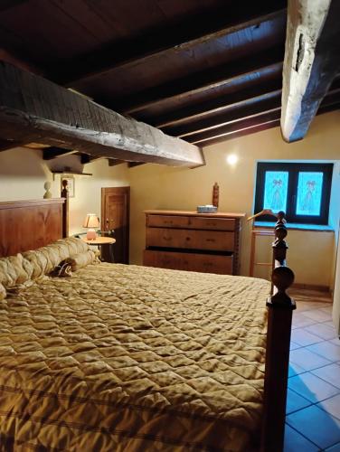 Ένα ή περισσότερα κρεβάτια σε δωμάτιο στο Il Gallo d' Oro - Pulcino