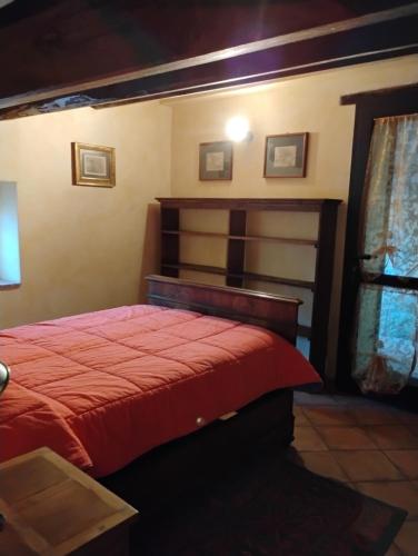 Ένα ή περισσότερα κρεβάτια σε δωμάτιο στο Il Gallo d' Oro - Scoiattolo