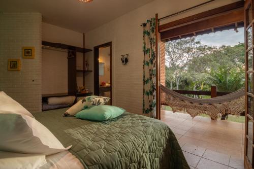 Postel nebo postele na pokoji v ubytování Pousada da Lua São Pedro