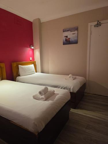 Postel nebo postele na pokoji v ubytování The Bailey Gastro Bar