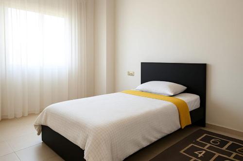 Кровать или кровати в номере iris appart vue dégagée, bon emplacement