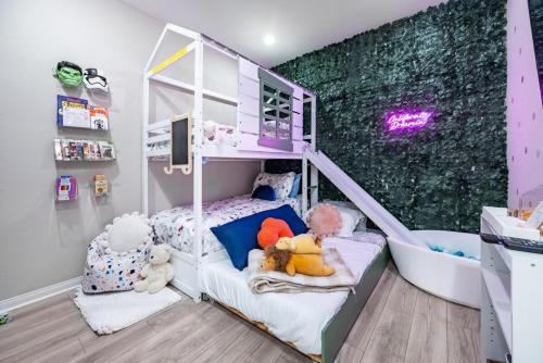 a childs bedroom with a bunk bed with stuffed animals at Chula Vista 3BR with Children's Playroom, Pool, Park and Sleeps 9 in Chula Vista