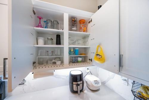 a kitchen with white walls and white countertops at Chula Vista 3BR with Children's Playroom, Pool, Park and Sleeps 9 in Chula Vista