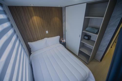 Ένα ή περισσότερα κρεβάτια σε δωμάτιο στο Torre U kooliving