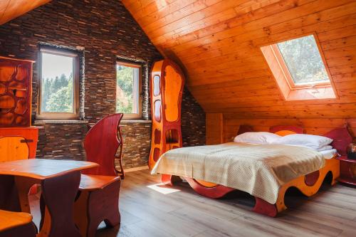 En eller flere senge i et værelse på Agroturystyka Monte Luna