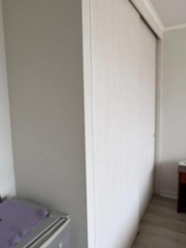 Giường trong phòng chung tại Departamento centro de viña