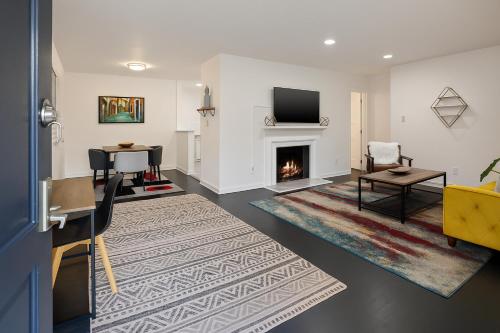 a living room with a fireplace and a tv at Quaint 1BD 1BA Bungalow in Los Angeles