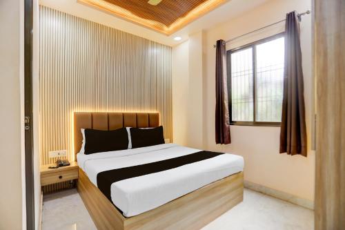 Giường trong phòng chung tại SPOT ON Ashirwad Residency