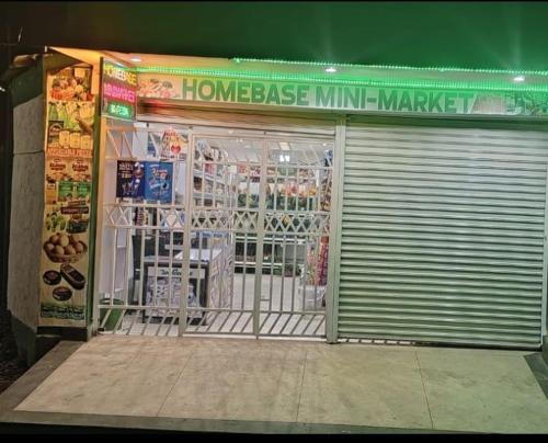 a store front with a gate in front of it at Homebase gardens guesthouse in Nakuru