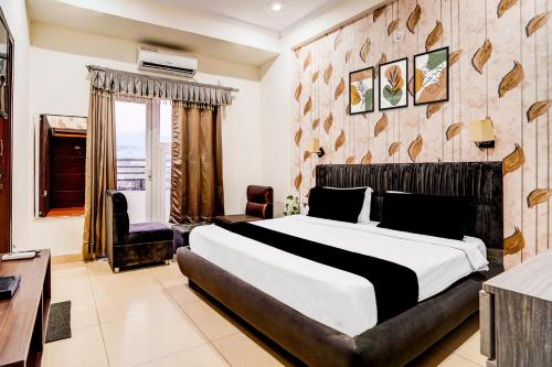 Ένα ή περισσότερα κρεβάτια σε δωμάτιο στο Hotel O DUNARA