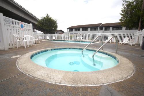 a small swimming pool in the middle of a building at EZ 8 Motel Old Town in San Diego