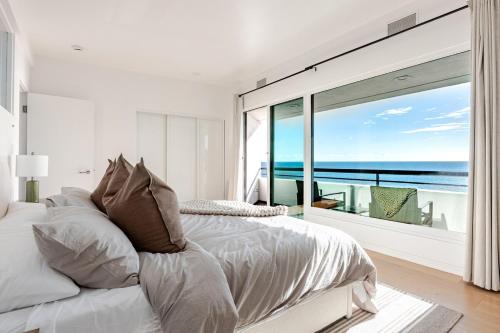 a bedroom with a bed with a view of the ocean at Gorgeous Malibu Retreat with #Instaworthy Ocean Views in Malibu Beach