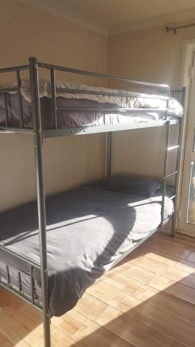 a couple of bunk beds in a room at Guest Stay in London