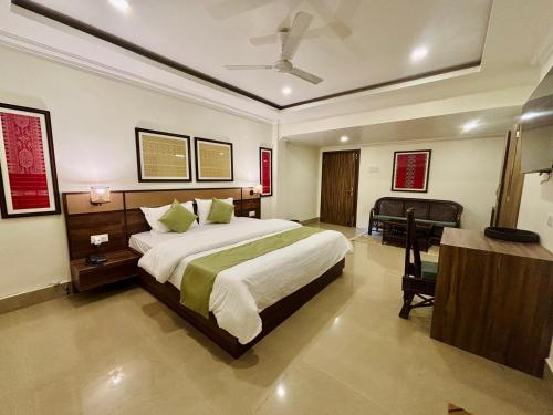 Ένα ή περισσότερα κρεβάτια σε δωμάτιο στο The Harmony Heritage Near Paltan Bazar