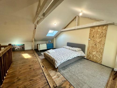 Кровать или кровати в номере A l'ombre de la Tour