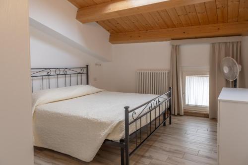 Кровать или кровати в номере La Corte Residence