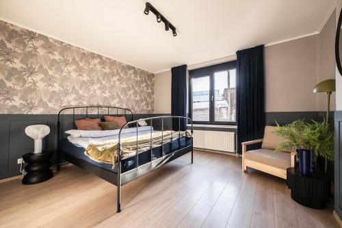 En eller flere senge i et værelse på Spacious 5-room house near Brussels with private parking