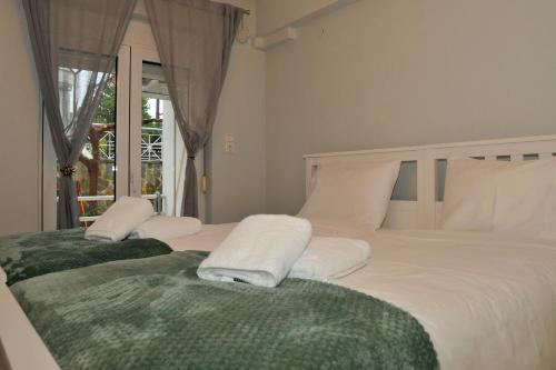 Postel nebo postele na pokoji v ubytování Anastasia Meteora Residence