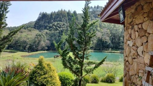 a view of a lake from a house at SIG - Rancho Desiam - Serra Gaúcha in Gramado