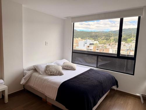 Ένα ή περισσότερα κρεβάτια σε δωμάτιο στο Apartamento Nuevo Central Piso 7 Terraza privada