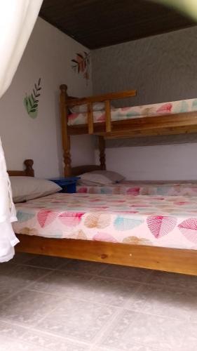 a bedroom with two bunk beds in a room at Suites com vista para o Mar in Angra dos Reis