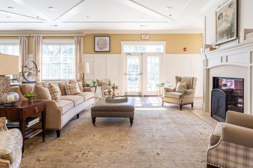 a living room with a couch and a fireplace at Kasa Southside Wilmington in Wilmington