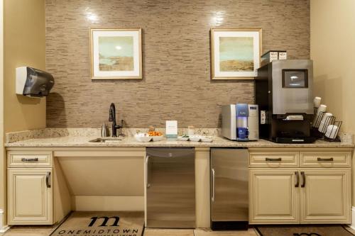 a kitchen with a counter top with a coffee maker at Kasa Southside Wilmington in Wilmington