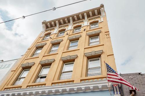 a building with an american flag in front of it at Kasa Gaslamp Quarter San Diego in San Diego