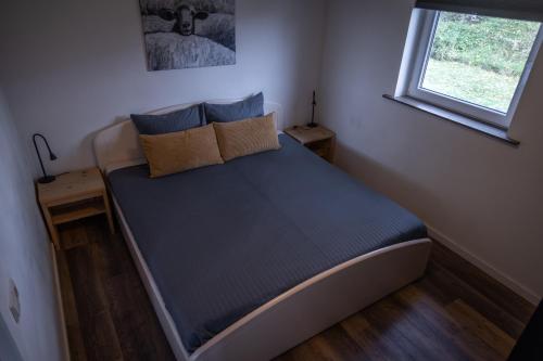 Ένα ή περισσότερα κρεβάτια σε δωμάτιο στο Landelijk gelegen bungalow De Kleine Wulfter