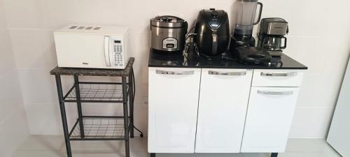 A cozinha ou kitchenette de Refúgio Colonial - Figueira - Praia de Mauá