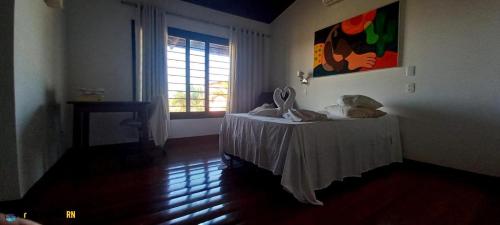 Ένα ή περισσότερα κρεβάτια σε δωμάτιο στο Casa Poti Tibau do Sul