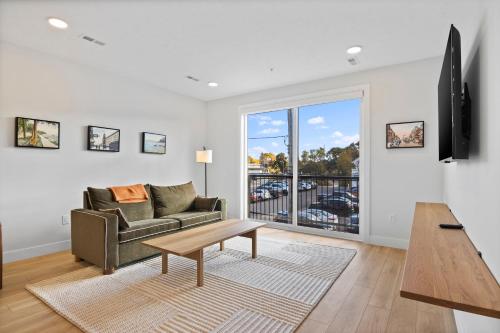 a living room with a couch and a table at The Loop Downtown By Kasa in Traverse City