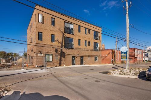 an empty street in front of a brick building at The Loop Downtown By Kasa in Traverse City